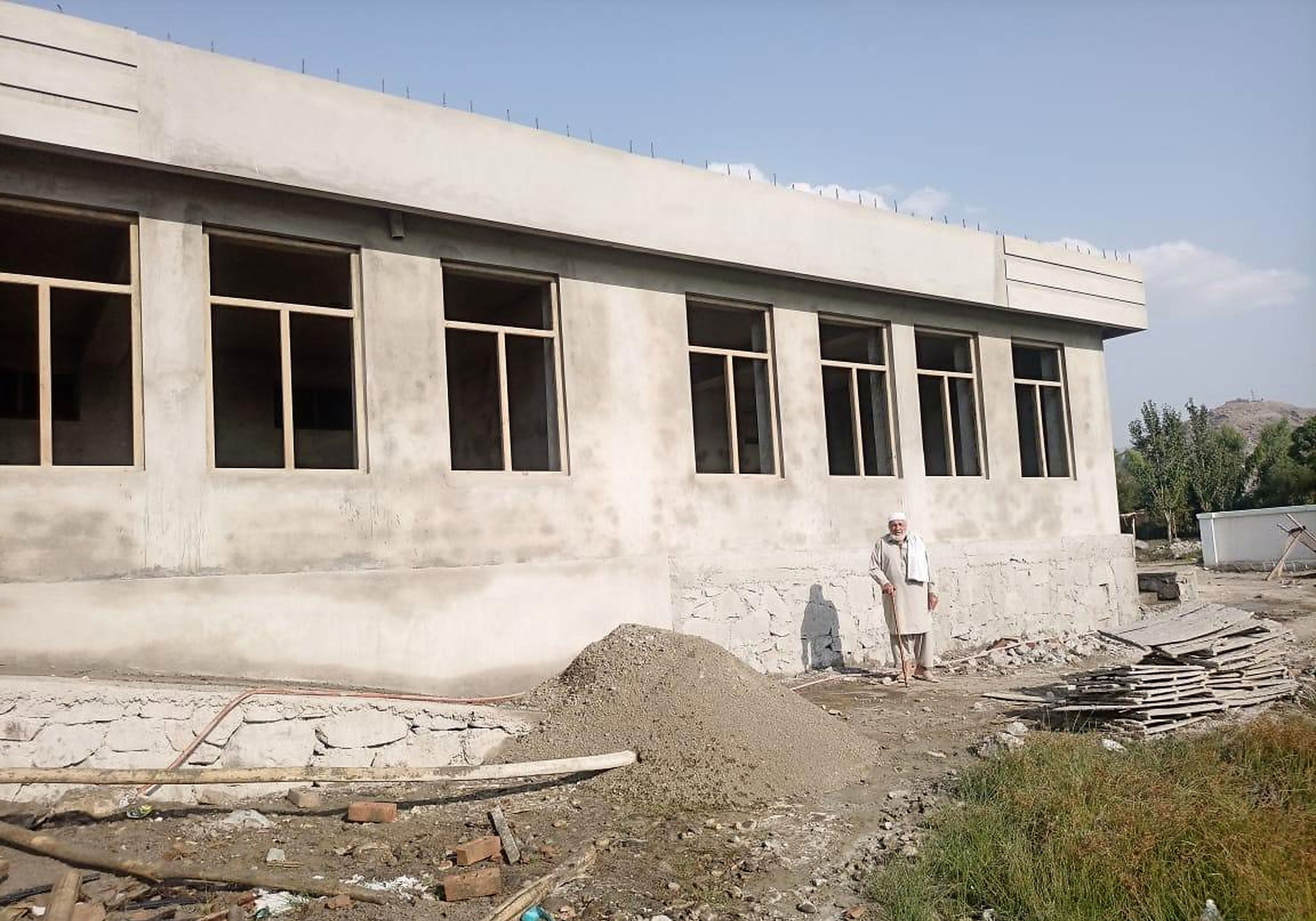 The classroom wing of the new school building with six window openings fitted with frames